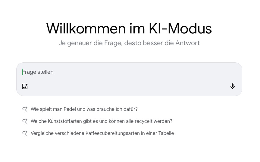 Google KI-Modus – Startbildschirm und Beispielabfragen Startansicht des Google-KI-Modus mit Eingabefeld „Frage stellen“ und Beispielen für Suchanfragen.